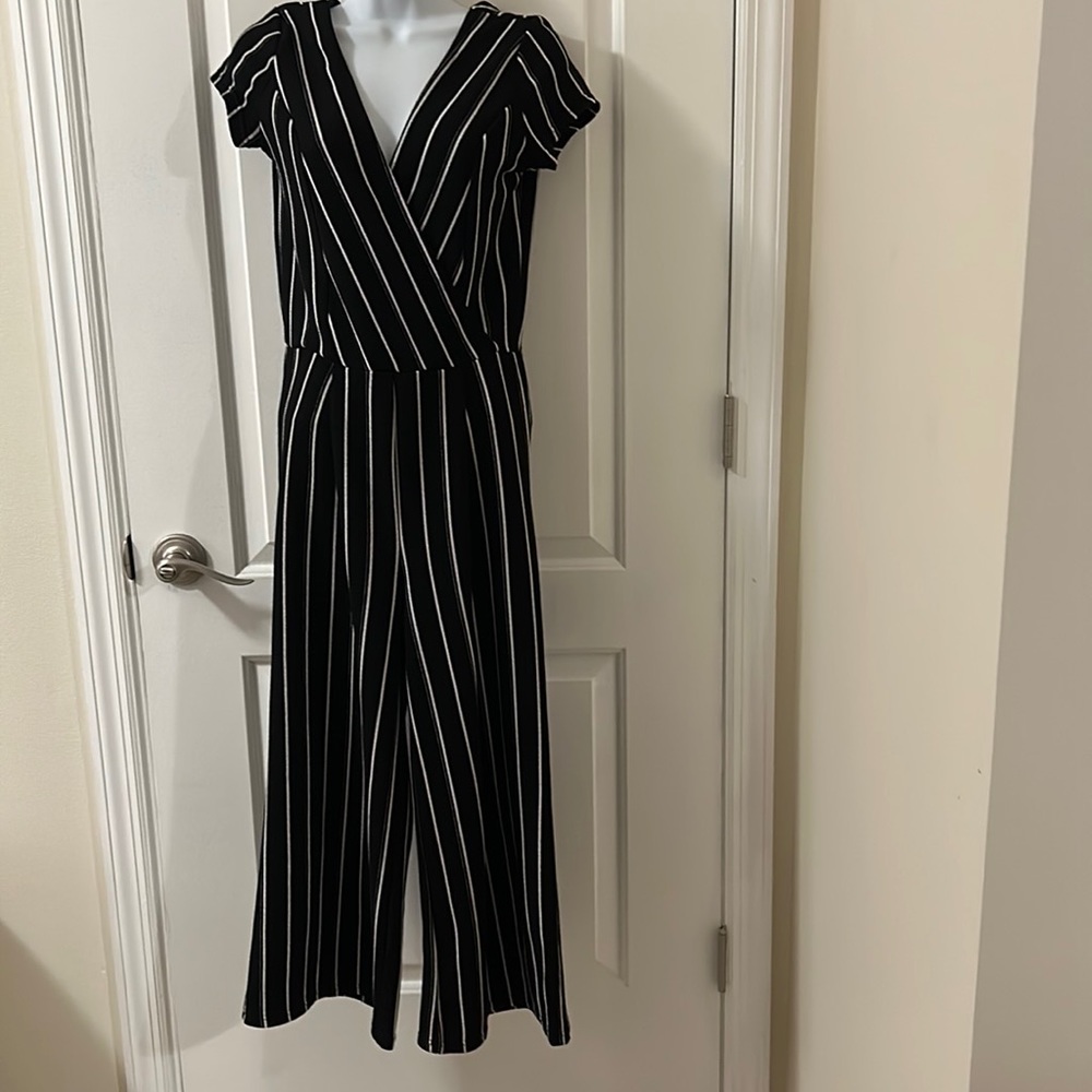 Jumpsuit Size medium. Black with white strips.